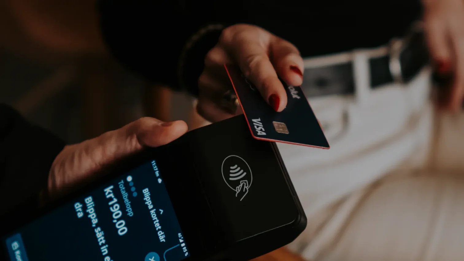 Staff using the WEIQ Pro POS system in a modern restaurant environment